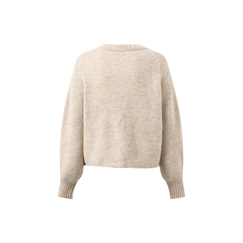 Close-up of 5GG knit texture and button detail on cropped V-neck cardigan