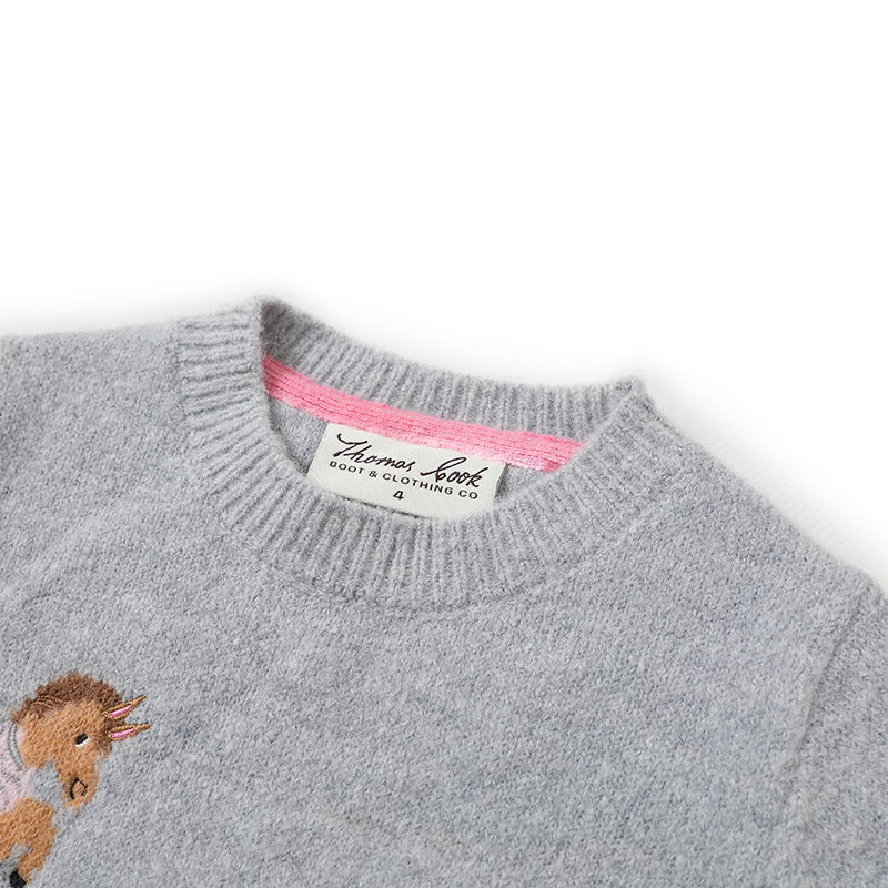 Close-up of 5GG girls stretch jacquard knit sweater showing wool blend texture contrast ribbing and horse head motif for private label customization